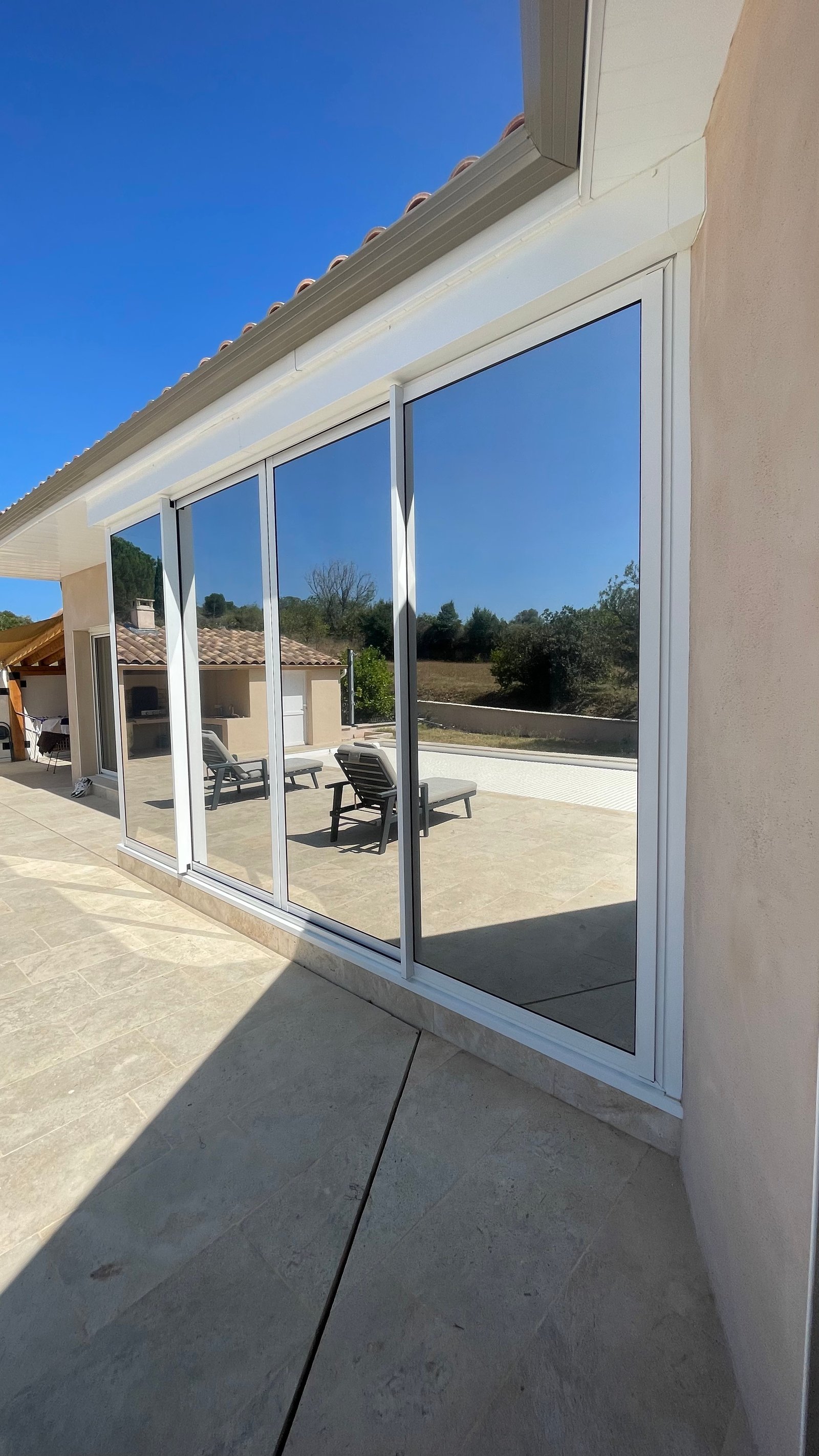 Baie vitrée villa film solaire miroir